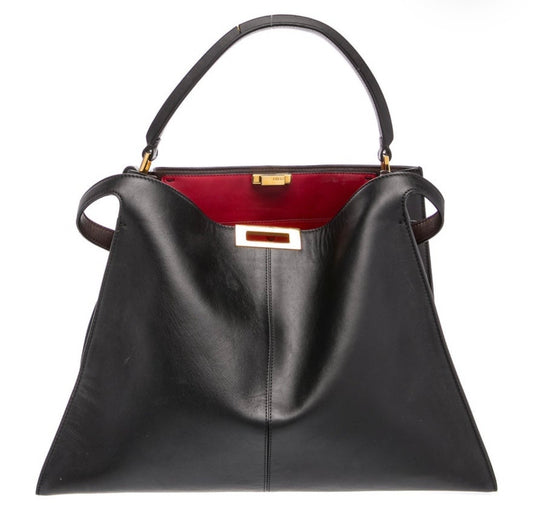 A black leather Fendi handbag with a structured top handle, gold-tone hardware, and a contrasting deep red interior lining, shown against a plain white background.