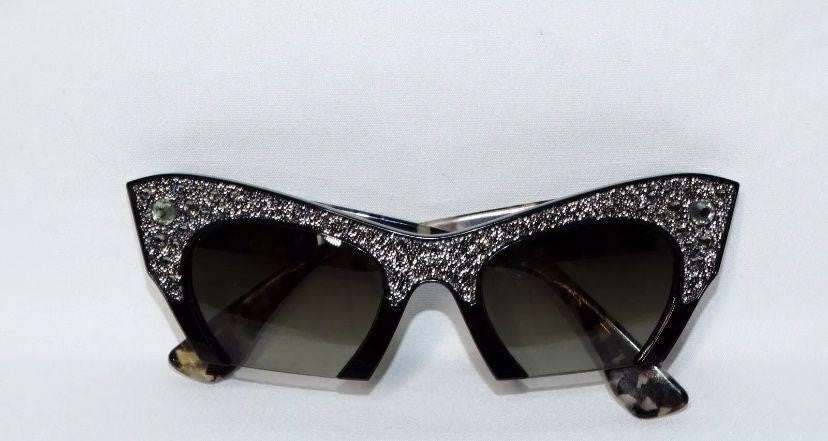Stunning Miu Miu Cat rimmed rockstar sunglasses